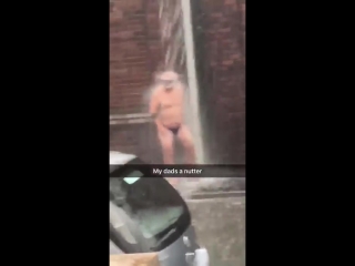 porn dad stands under overflowing gutter wearing just swimming trunks and a snorkel porn